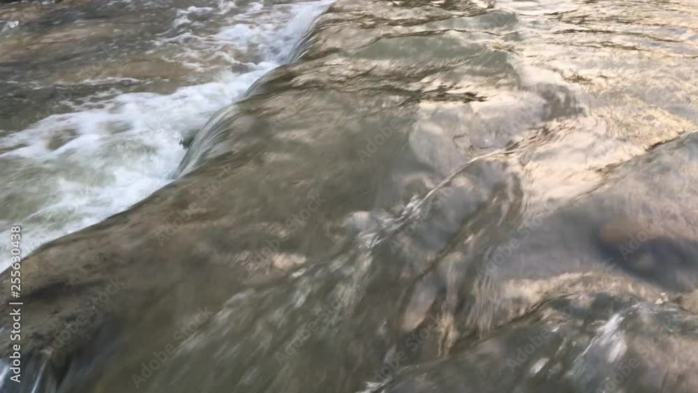 Fast river stream with rocks on cold season Fast river stream with rocks on cold season