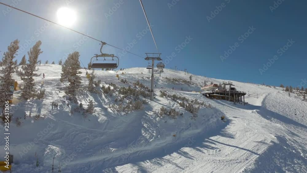 View from a ski lift to another ski lift between slopes View from a ski lift to another ski lift between slopes