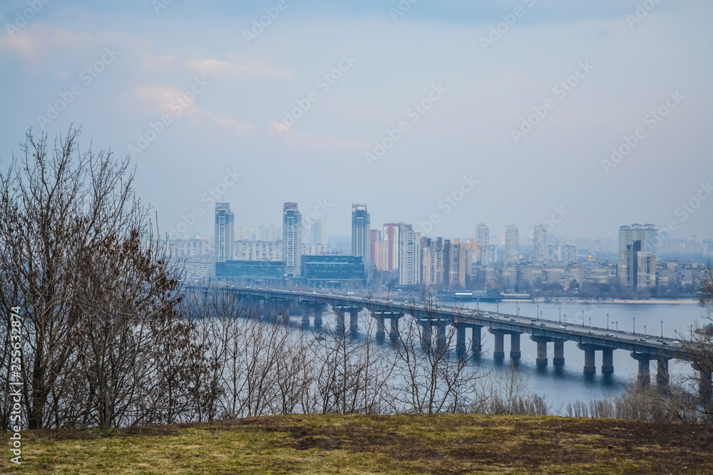 Beautiful view of the river and of Kiev, Ukraine. Sunny spring day. Bridges and city architecture. Landscape. Beautiful view of the river and of Kiev, Ukraine. Sunny spring day. Bridges and city architecture. Landscape.