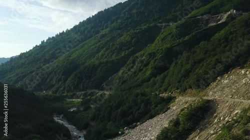 4K drone fly forwards footage, over huts of a village, dusty road, mountain, cloudy weather, in Tunca District, Rize Province, Turkey photo