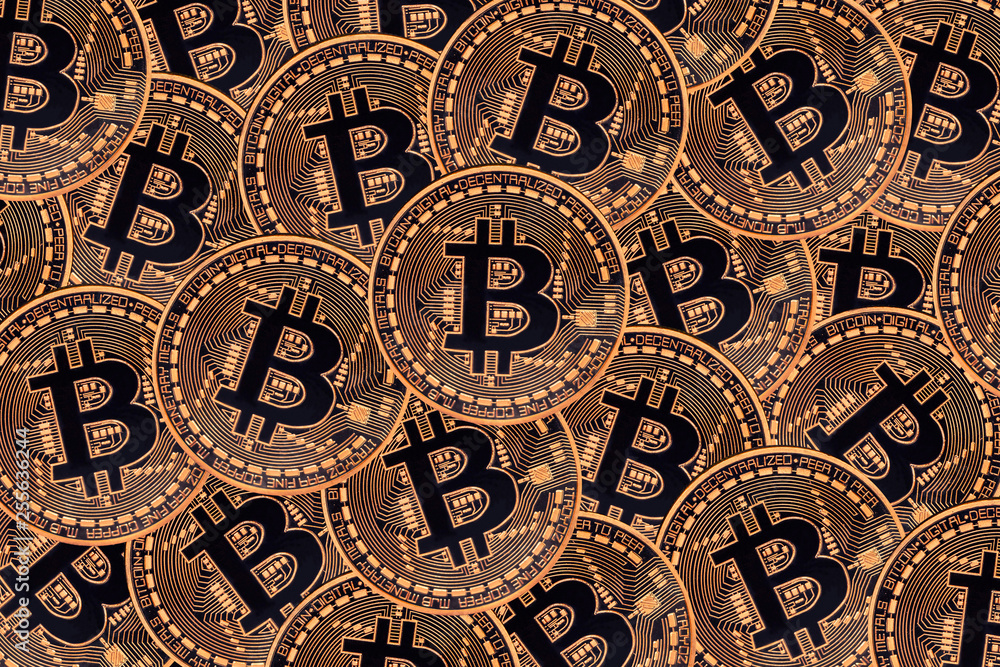 Many bronze coins with Bitcoin sign, It is a cryptocurrency background. Many bronze coins with Bitcoin sign, It is a cryptocurrency background.