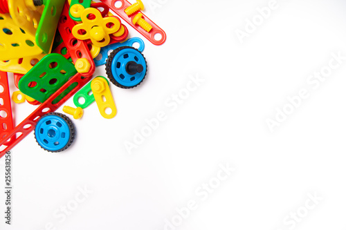 Frame for text. Top view of multicolor kids toy construction blocks bricks on white background. Copyspase. flat lay. Children toys on the table