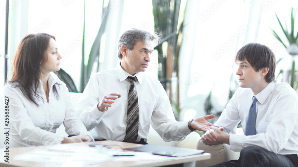 project leader talking to business team in the workplace.