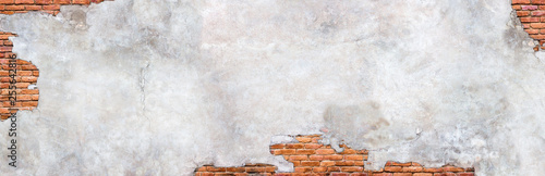 Foto Damaged plaster on brick wall background