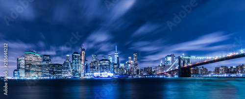 Manhattan panoramic skyline at night with Brooklyn Bridge. New York City, USA. Office buildings and skyscrapers at Lower Manhattan (Downtown Manhattan). © resul