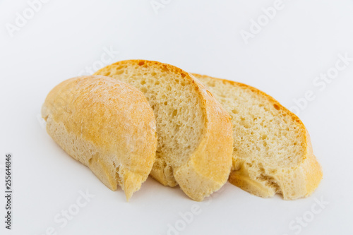 Fresh sliced ciabatta bread on a white background