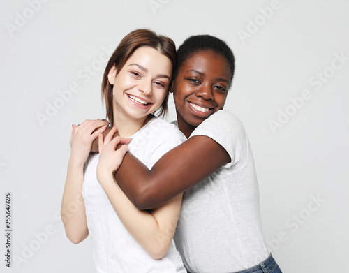 Photos Shot of happy interracial homosexual couple hugging