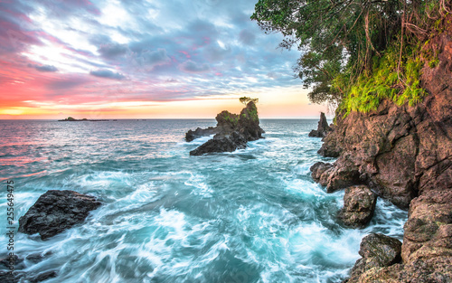 Long exposure of the sunset over the Pacific Ocean on the west side of the Osa Peninsula, Costa Rica. photo