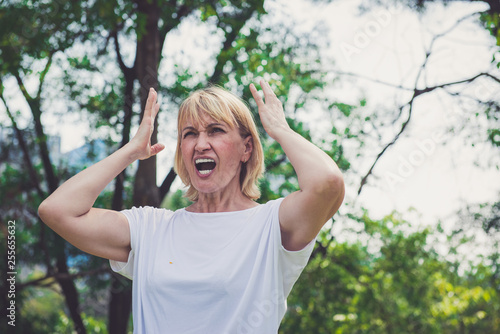 Принти на полотні Senior woman screaming in the park