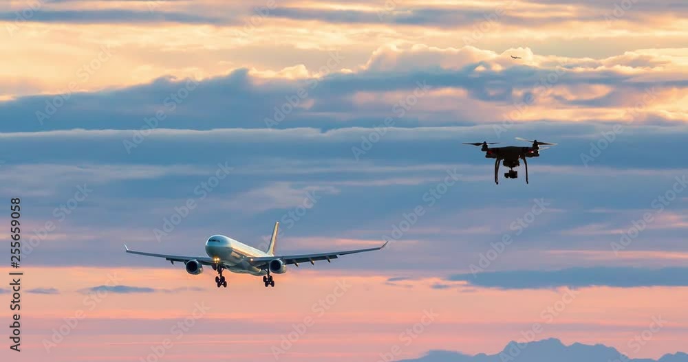 An animation of a aircraft on approach to an airport with a drone flying towards the aircraft. An animation of a aircraft on approach to an airport with a drone flying towards the aircraft.