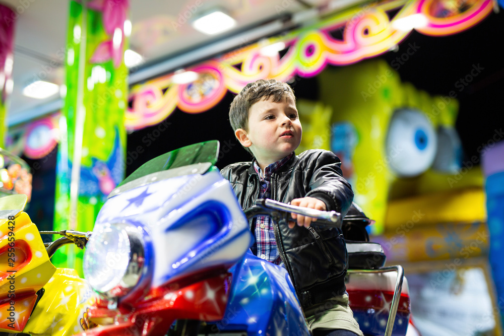  boy at the fair on a motorcycle