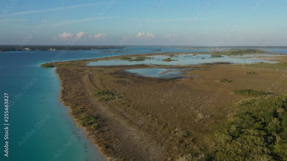 Expansive wide aerial view lake Bacalar the lagoon of seven colors in Quintana Roo, Mexico Expansive wide aerial view lake Bacalar the lagoon of seven colors in Quintana Roo, Mexico