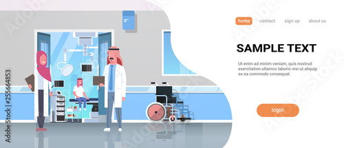 arab doctors discussing in hospital corridor with wheelchair open door to surgery room arabic man sitting operating table modern clinic interior flat full length horizontal copy space