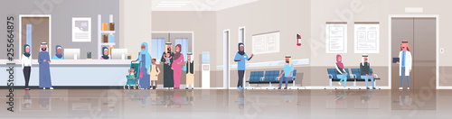 arabic patients in traditional clothes standing line queue at hospital reception desk waiting hall doctors consultation healthcare concept clinic interior full length horizontal banner flat