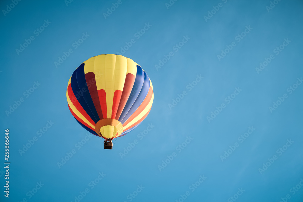 Fototapeta premium Colorful hot air balloon in the blue sky