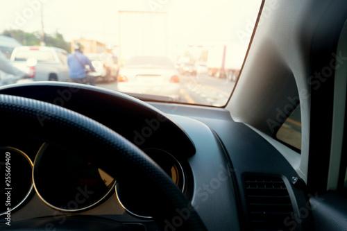 View inside the car with blurred road traffic conditions