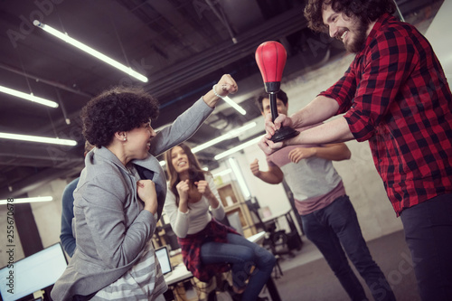 multiethnics business team boxing at office