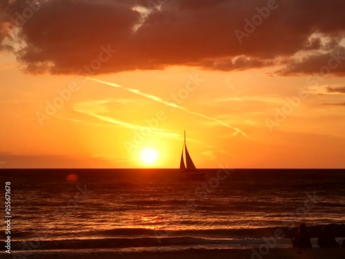 Sunset and a Sailboat