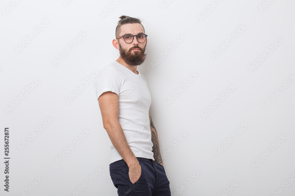 hipster, people concept - hipster guy wearing glasses with arms crossed on a white background hipster, people concept - hipster guy wearing glasses with arms crossed on a white background