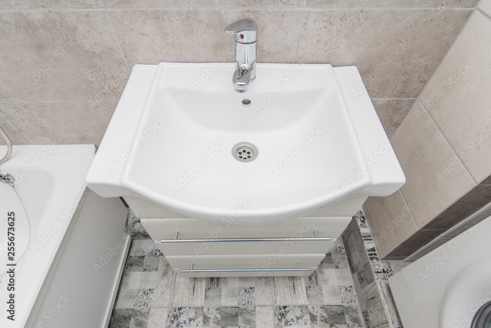 Fototapeta premium The photo of a sink in a bathroom