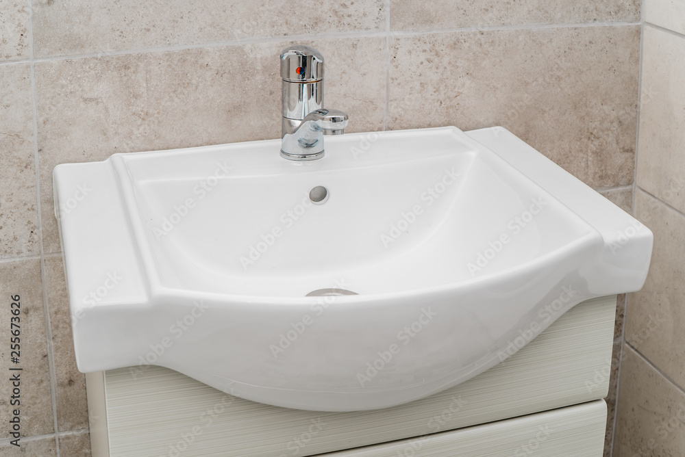 Fototapeta premium The photo of a sink in a bathroom