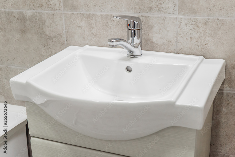 Fototapeta premium The photo of a sink in a bathroom