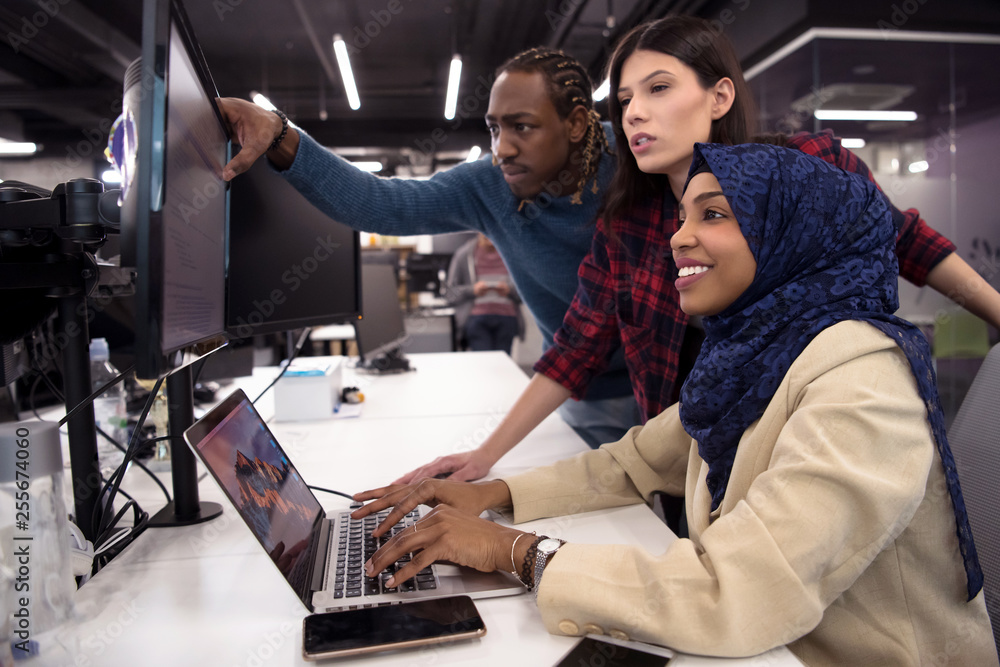 multiethnics team of software developers working together Stock Photo ...