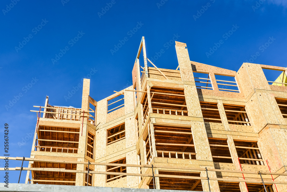 Brand new low-rise building on blue sky background on sunny day in British Columbia, Canada
