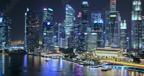 Skyscrapers and modern office buildings in Singapore at night. Luxury property photo