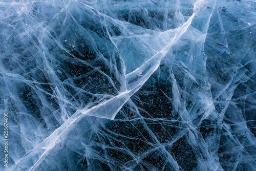 Ice crack texture, Close-up texture surface cracks of the natural ice in frozen water at Baikal lake, Russia.