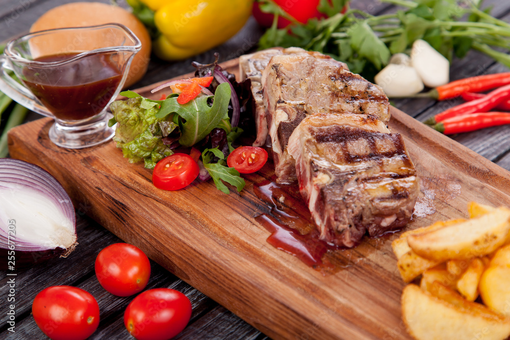 juicy and appetizing steak tamogavok of horse meat on the table, for design in cooking juicy and appetizing steak tamogavok of horse meat on the table, for design in cooking