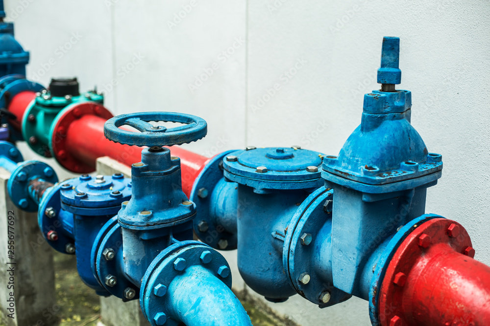 color gas pipes. Next to the light wall of the building. color gas pipes. Next to the light wall of the building.