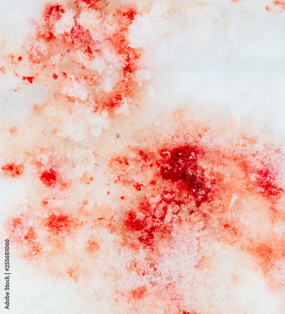 Red blood on white snow as a background Red blood on white snow as a background