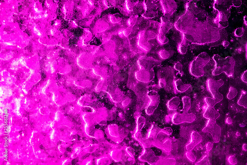 Ice on pink glass as abstract background