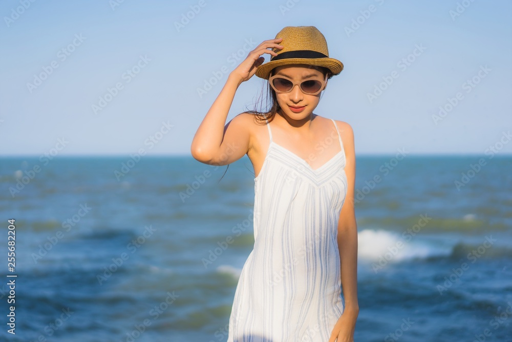 Portrait beautiful young asian woman happy smile relax around neary beach and sea Portrait beautiful young asian woman happy smile relax around neary beach and sea
