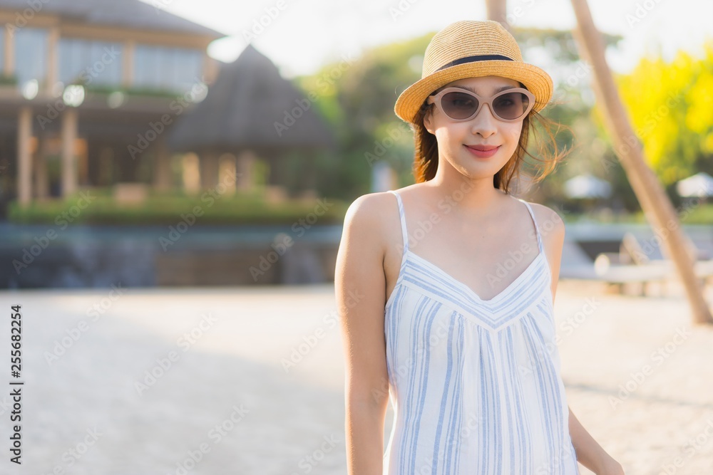 Portrait beautiful young asian woman happy smile relax around neary beach and sea