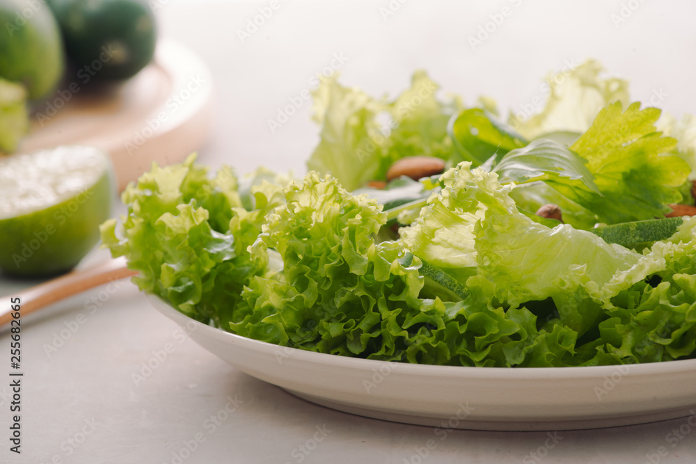 Mix of green fruits and vegetables on rustic wooden background Mix of green fruits and vegetables on rustic wooden background