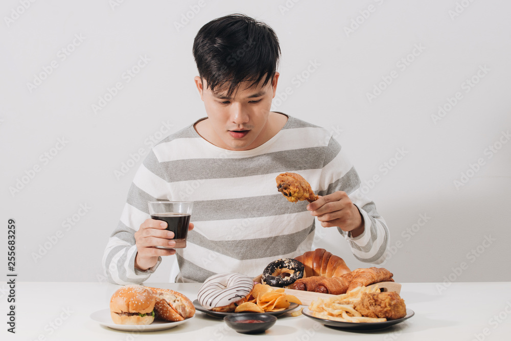 People eating fast food concept hand holding deep fried chicken carbonated soft drink People eating fast food concept hand holding deep fried chicken carbonated soft drink