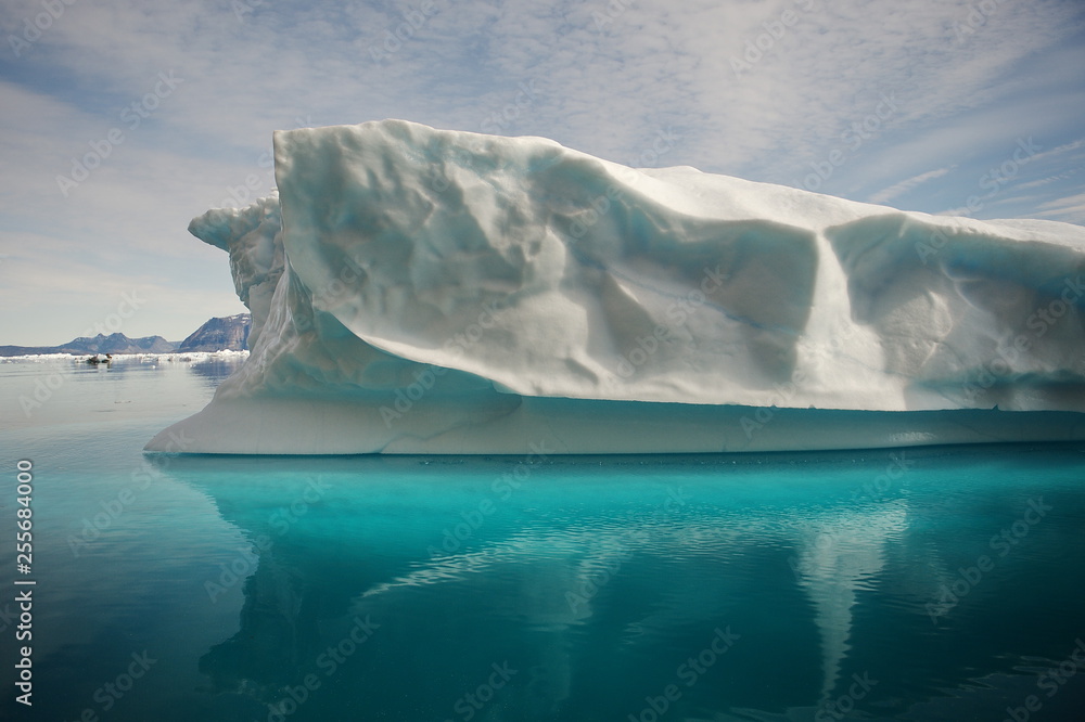 Icebergs, ocean, mountains. Near the coast of Greenland. Disco Bay.