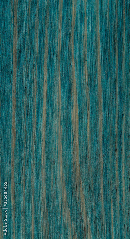 The background of the structure of the pattern of wooden natural painted boards. Green lines of the structure of the saw cut of the tree. Cut off picture, vertical, close-up. The background of the structure of the pattern of wooden natural painted boards. Green lines of the structure of the saw cut of the tree. Cut off picture, vertical, close-up.