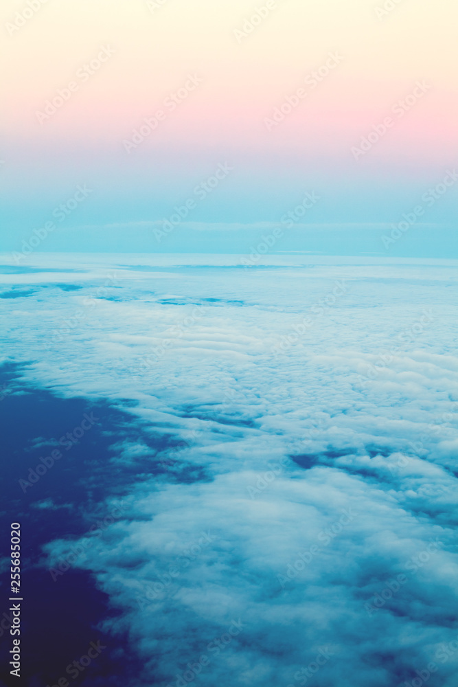Beautiful sky above clouds, dawn pastel color. View sky from plane