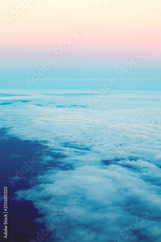 Beautiful sky above clouds  dawn pastel color. View sky from plane
