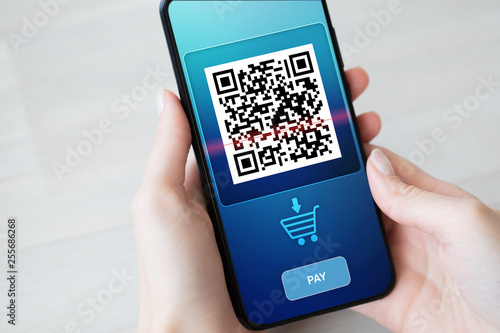 QR code mobile phone scan on screen. Business and technology concept.