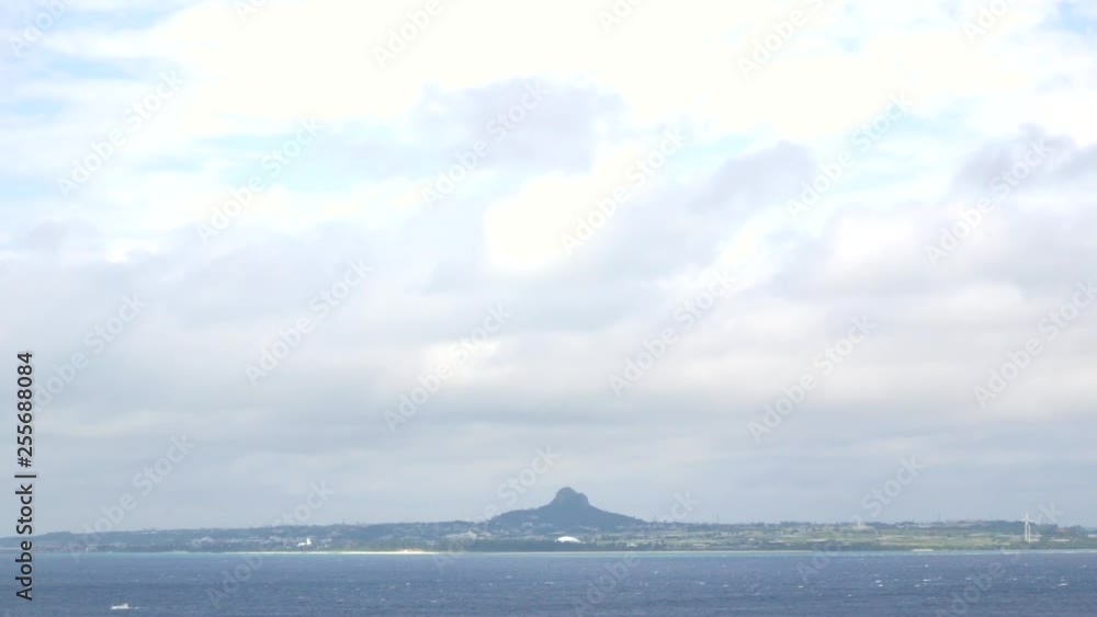 White beach with some wind blowing and small wave in summer holiday time in Okinawa, Japan in warming color tone -Sea view White beach with some wind blowing and small wave in summer holiday time in Okinawa, Japan in warming color tone -Sea view