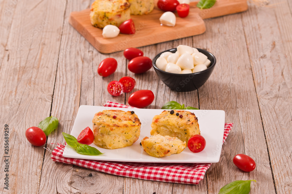 Potato gratins with mozzarella and tomatoes. Potato gratins with mozzarella and tomatoes.