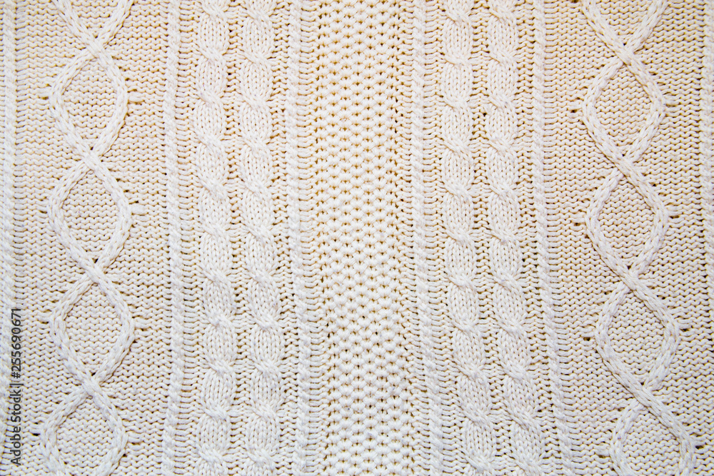 background of a large knitted fabric with braids, copy space