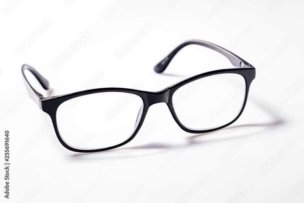 Black eye glasses spectacles with shiny black frame For reading daily life To a person with visual impairment isolaged on white background. Black eye glasses spectacles with shiny black frame For reading daily life To a person with visual impairment isolaged on white background.