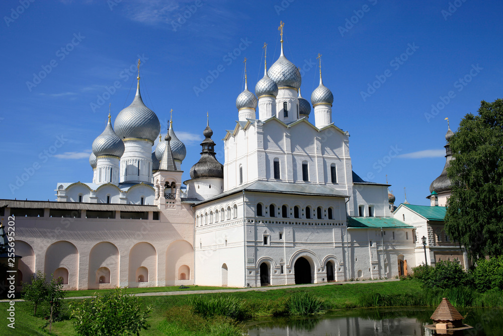 On a sunny summer day, a view of the Church of the Resurrection and the Assumption Cathedral in the Rostov Kremlin. Gold ring of Russia