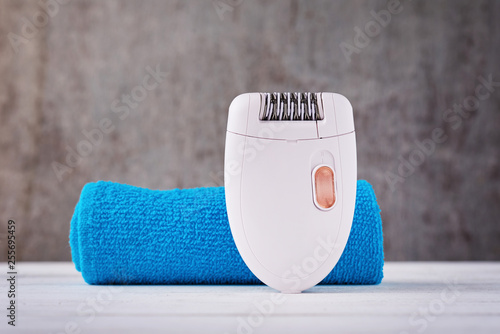 Close up of epilator on background with towel
