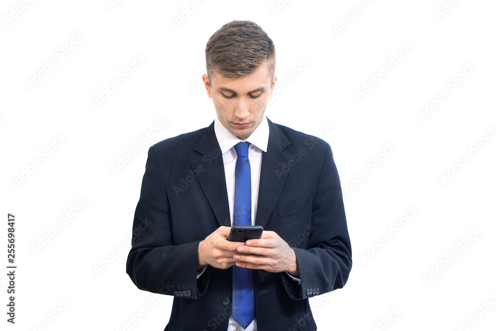 young attractive serious business man using mobile smart phone, isolated on white young attractive serious business man using mobile smart phone, isolated on white